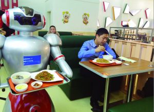 盐城一餐馆用机器人当服务员:会和顾客打招呼
